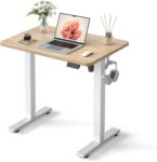 Compact standing desk with electric height adjustment.